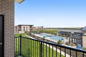 Lenexa apartment for rent - a view of the pool from a balcony at the resort