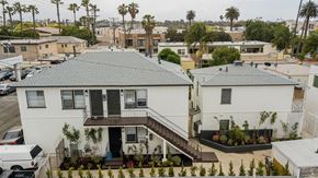 Santa Monica apartment for rent - a white house with a gray roof in a neighborhood