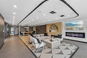 Philadelphia apartment for rent - A modern living room with a fireplace and a large painting on the wall.