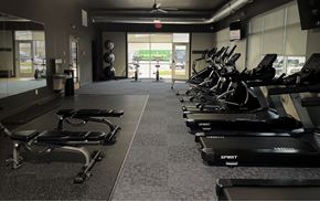 Lincoln apartment for rent - A gym with treadmills and elliptical machines.