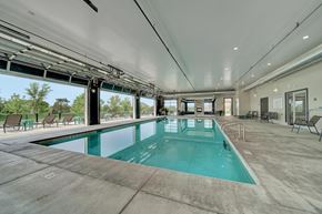 Lincoln apartment for rent - A large indoor/outdoor swimming pool with a glass enclosure and a sunroof.