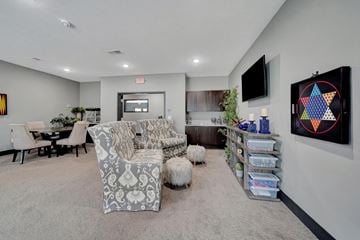 Lincoln apartment for rent - A living room with a grey carpet and a white sofa.