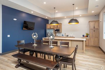 Lincoln apartment for rent - A modern dining room with a wooden table and chairs.