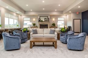 Lincoln apartment for rent - A spacious living room with a fireplace and comfortable seating.