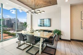 Atlanta apartment for rent - a dining room with a table and chairs and a large window