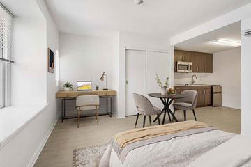 Santa Monica apartment for rent - A modern living room with a dining table and chairs.