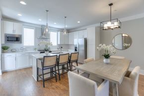 Franklin apartment for rent - A modern kitchen with a dining table and chairs.