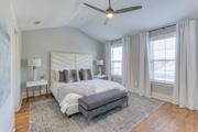 Franklin apartment for rent - A bedroom with a large bed and a ceiling fan.