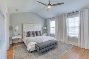 Franklin apartment for rent - A bedroom with a large bed and a ceiling fan.