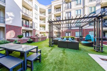 Gorgeous courtyard with gas grills, fire pit, and private cabanas