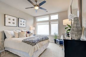 Denver apartment for rent - A bedroom with a large bed and a ceiling fan  at Alara Union Station, Colorado, 80202