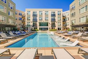 Denver apartment for rent - a swimming pool with lounge chairs in front of at ALARA Union Station Apartments in Denver, 80202