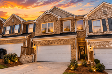 Snellville townhouse for rent - A house with a garage and a car parked in front.