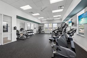 Bradenton apartment for rent - A spacious gym with a variety of exercise equipment.