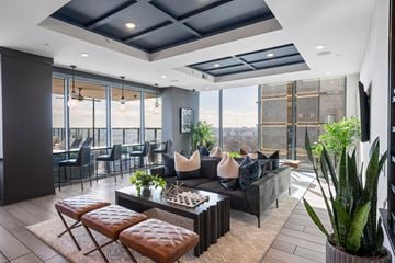 Atlanta apartment for rent - a living room with couches and chairs and a table