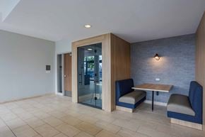 Chicago apartment for rent - A room with a table and chairs and a glass door.