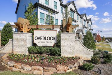 Dacula townhouse for rent - A sign that says Overlook at Mill Creek Established 2021.