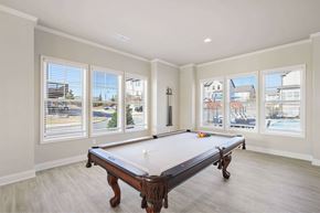 Dacula townhouse for rent - A pool table in a room with a view of the city.