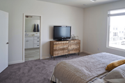 Phoenix apartment for rent - a bedroom with a bed and a television on a dresser at Novella Biltmore, Arizona, 85016