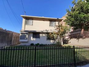 Los Angeles apartment for rent - A house with a black fence in front of it.