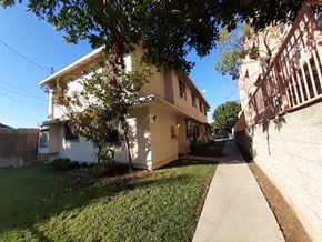 Los Angeles apartment for rent - A white house with a tree in front of it.