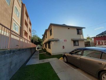 Los Angeles apartment for rent - A car is parked on the side of a street.