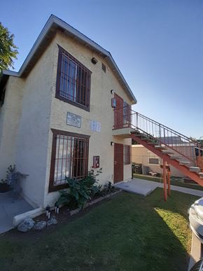 Los Angeles apartment for rent - A house with a red door and a balcony.