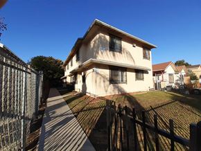 Los Angeles apartment for rent - A house with a fence in front of it.