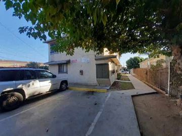Los Angeles apartment for rent - A white van is parked on the side of a street.