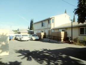 North Hollywood apartment for rent - A white car is parked in front of a house.