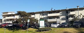Los Angeles apartment for rent - an apartment building with cars parked in front of it