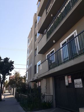 Los Angeles apartment for rent - an apartment building with balconies and a sidewalk