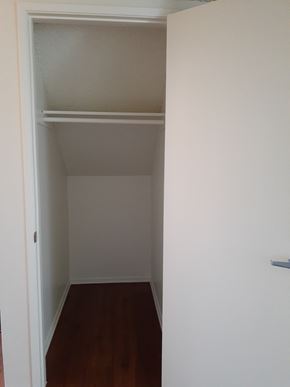 Canoga Park apartment for rent - A white closet with a shelf and a door.