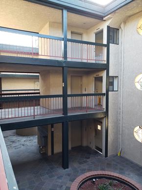 San Pedro apartment for rent - a view of a building with a balcony and a fire pit