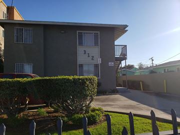 Los Angeles apartment for rent - A grey building with the number 312 on it.