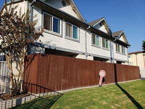 Wilmington apartment for rent - A brown fence with a red sign that says "BEEP" on it.