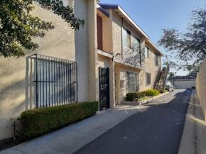 Los Angeles apartment for rent - A row of houses with black iron gates.