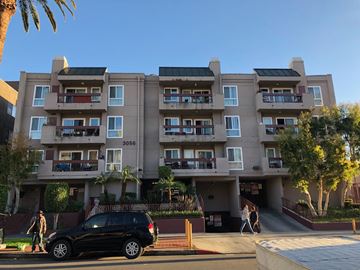 Los Angeles apartment for rent - a car parked in front of an apartment building