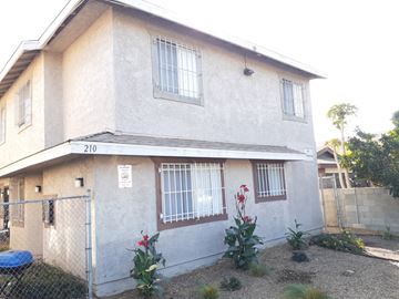 Los Angeles apartment for rent - A house with the number 210 on the front.