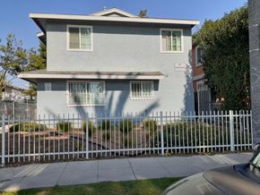 Los Angeles apartment for rent - A house with a white fence in front of it.