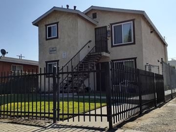 Los Angeles apartment for rent - A house with a black fence in front of it.