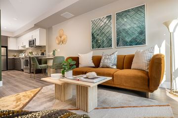 Los Angeles apartment for rent - A living room with a brown couch and a coffee table in the middle.