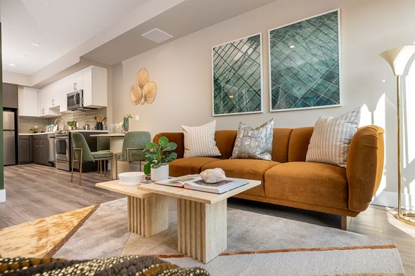 Los Angeles apartment for rent - A living room with a brown couch and a coffee table in the middle.