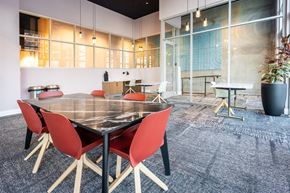 Los Angeles apartment for rent - A modern dining room with a large table and chairs.