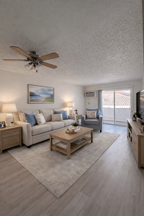 North Hollywood apartment for rent - A living room with a couch, coffee table, and a ceiling fan.