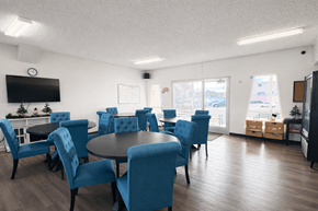 North Hollywood apartment for rent - A conference room with blue chairs and a television on the wall.