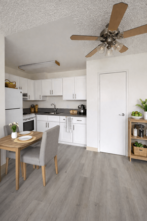 North Hollywood apartment for rent - A kitchen with a table and chairs in front of a refrigerator.