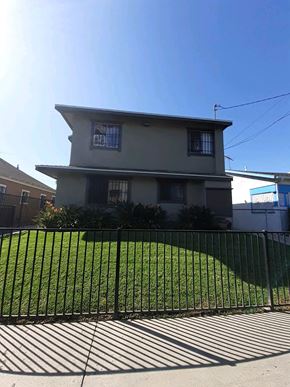 Los Angeles apartment for rent - A house with a black fence in front of it.