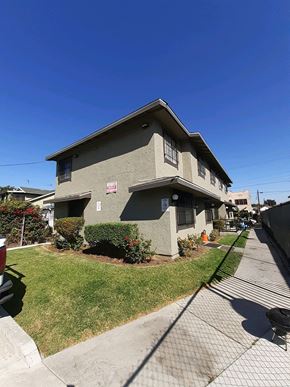 Los Angeles apartment for rent - A house with a grey roof and a white sign on it.