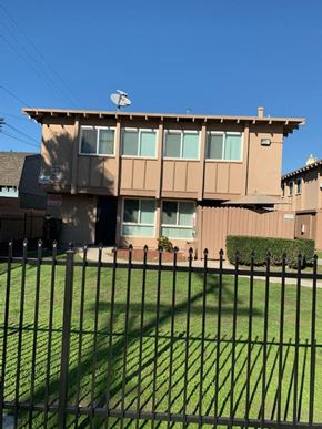 Los Angeles apartment for rent - A house with a black fence in front of it.